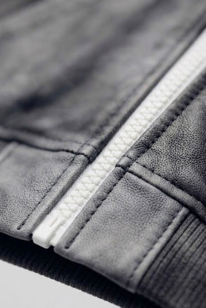 R4RE AEON waxed zip up — lower front panel detail showing wax-wash texture variation and suede brushed finish
